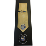 A golden coloured silk tie with the Institute of Quarrying logo on.